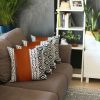 Set of Four 18" Brown Black and White Geometric Fabric and Faux Leather Throw Pillows
